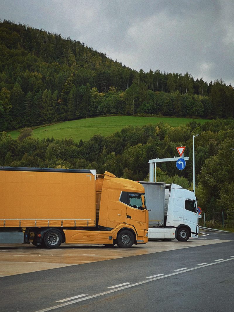 Two trucks at a highway junction